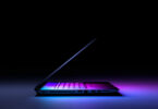 side view laptop pc with color light dark technology gaming concept