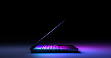 side view laptop pc with color light dark technology gaming concept